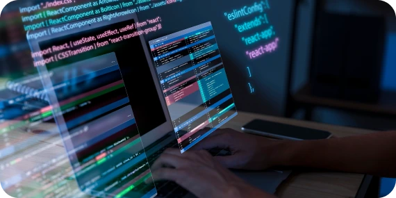 Custom software development services represented by a developer writing and reviewing application code